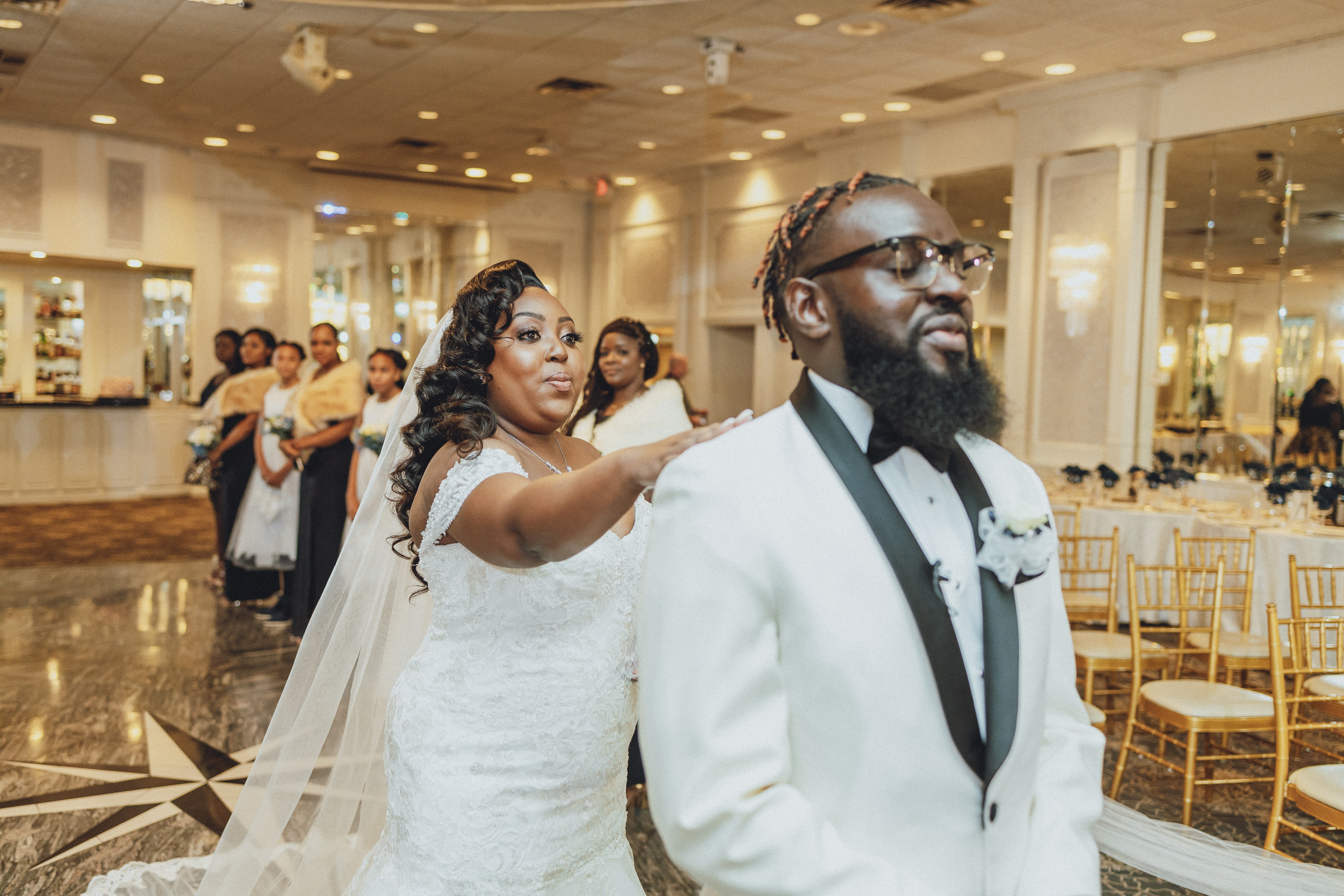 Bride and groom entering their ballroom wedding reception