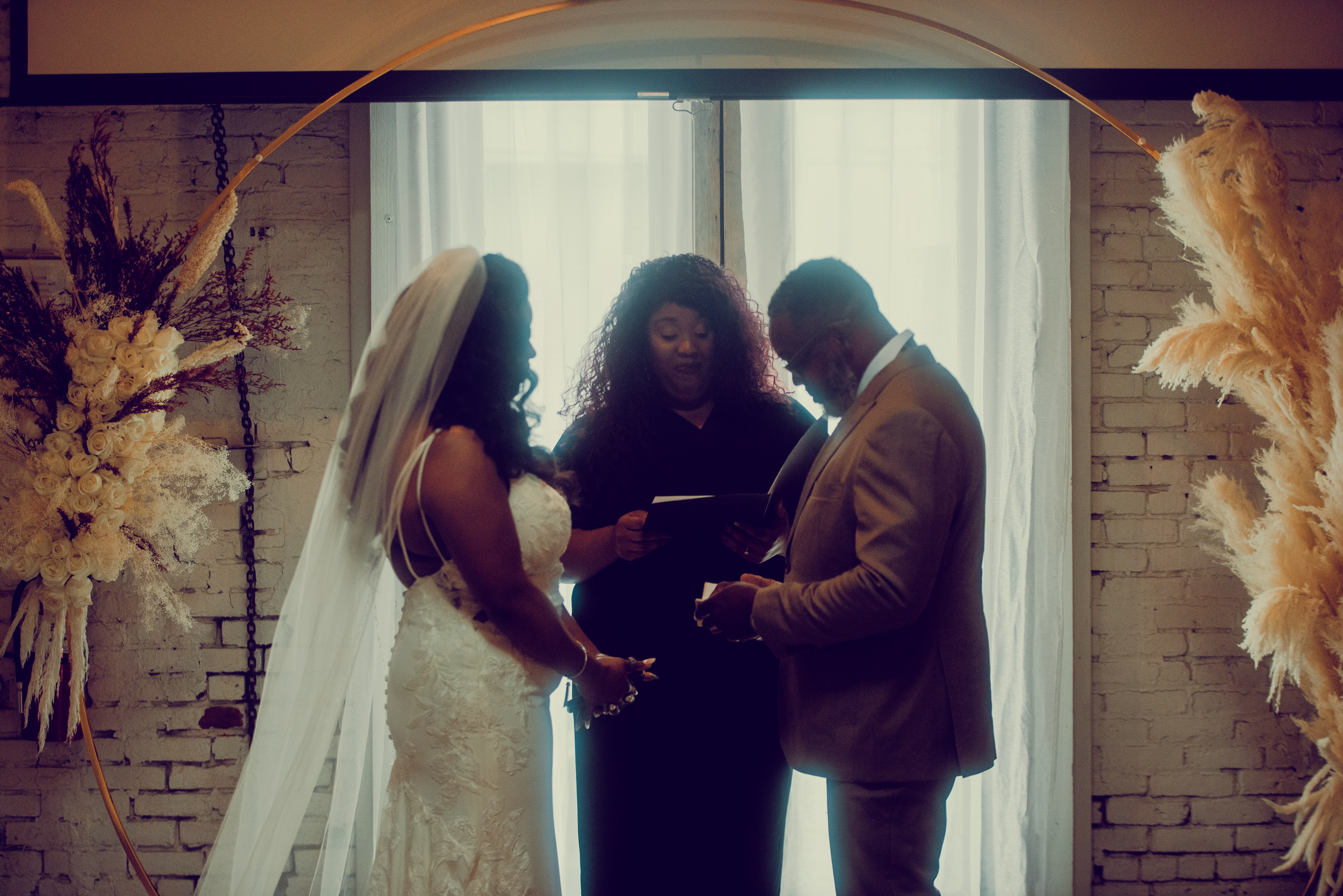 Bride portrait under the ceremony arch
