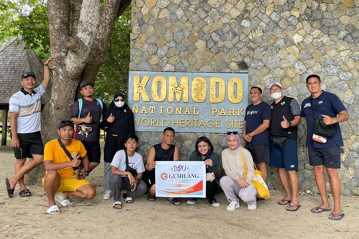 GumilangTour group photo at the Komodo National Park entrance sign