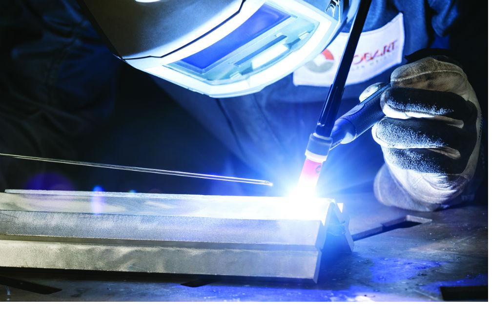 Certified welder TIG welding aluminum with bright arc