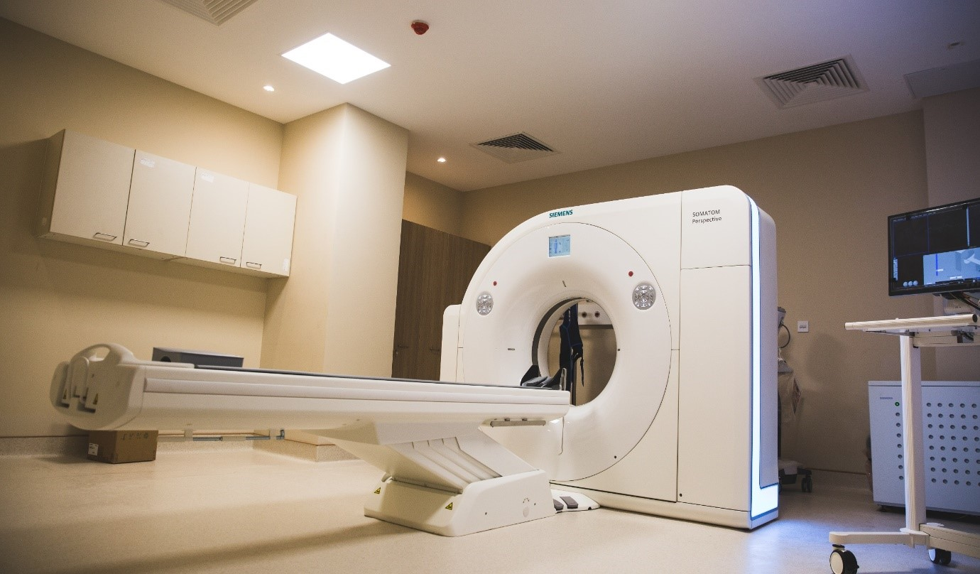 Meitra Hospital Siemens SOMATOM Perspective CT scanner room with motorized examination table.