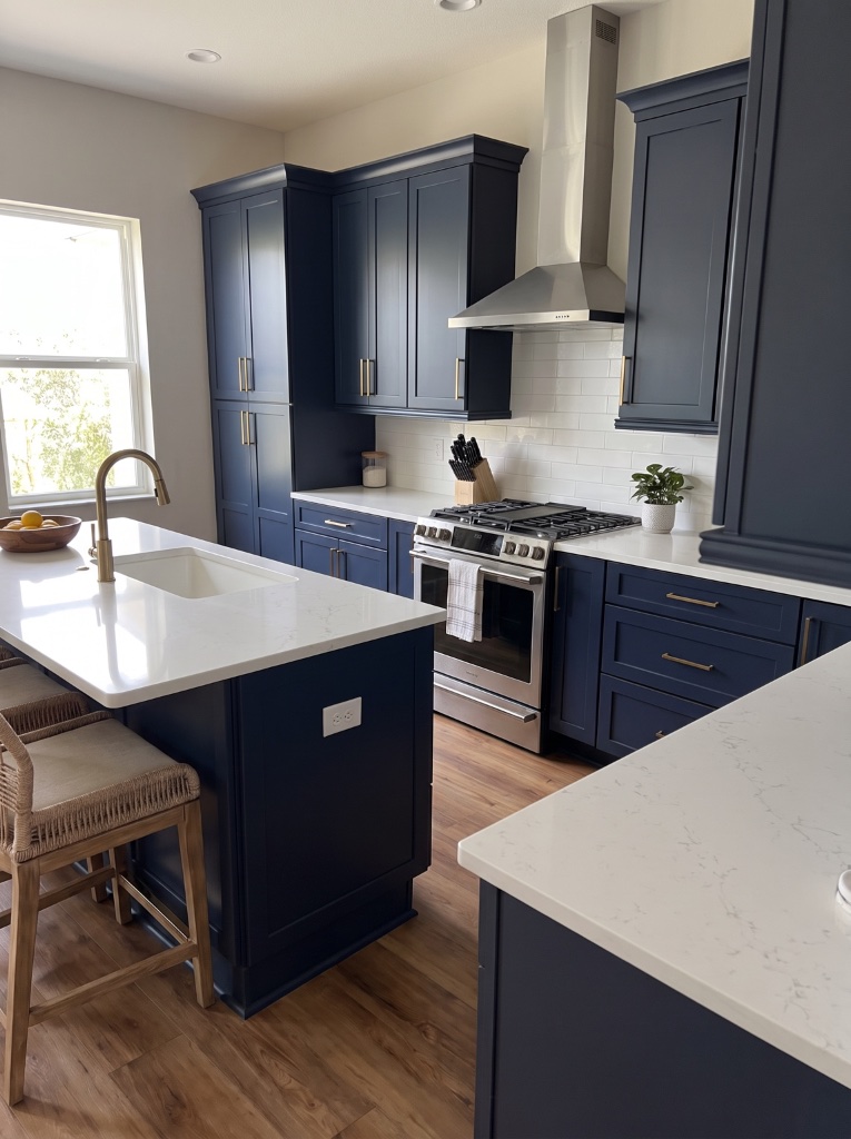 Detailed view of navy refinished cabinets with brass hardware in Naples, Florida.