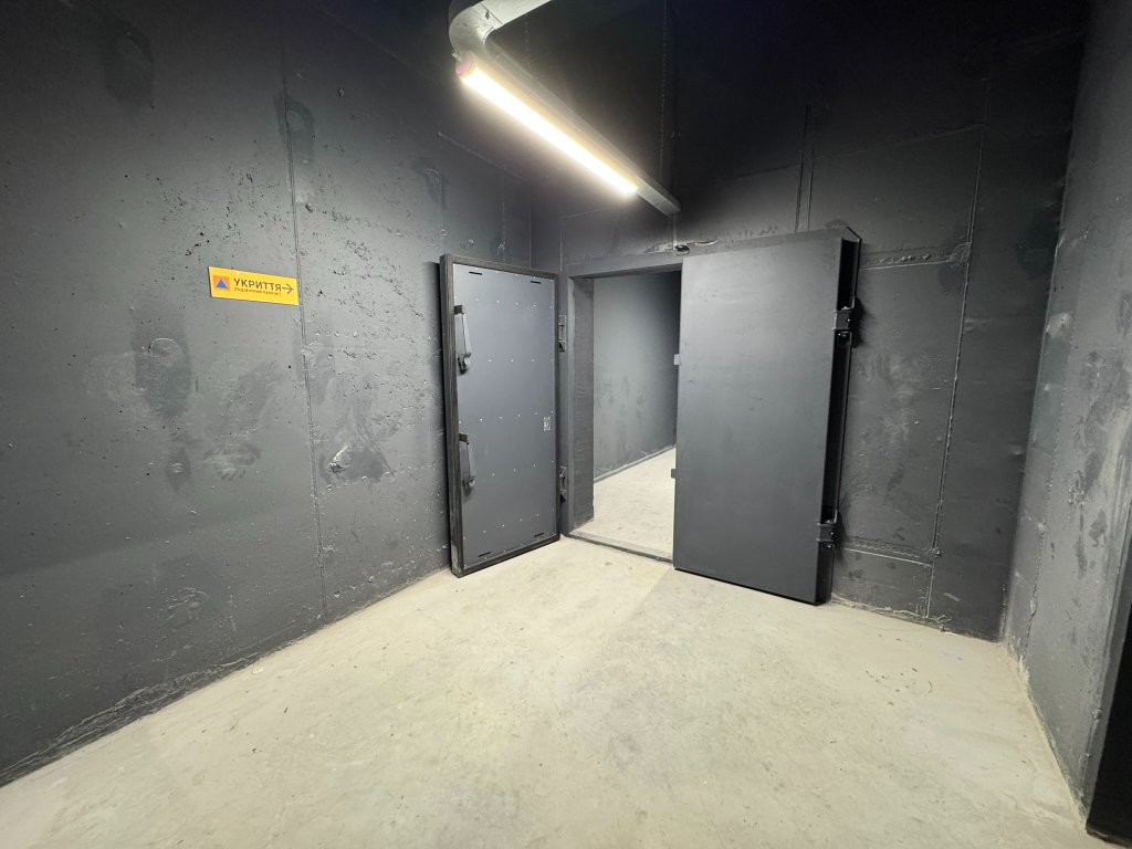Black blast door open in warehouse