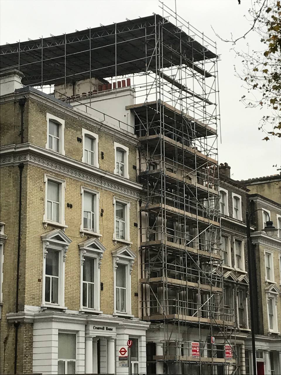 Nazemi Construction — roof-level scaffold works, Cromwell House area
