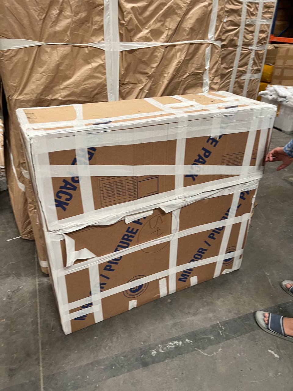 Removal boxes in warehouse — the Nazemi family move from London to Dubai, 2021