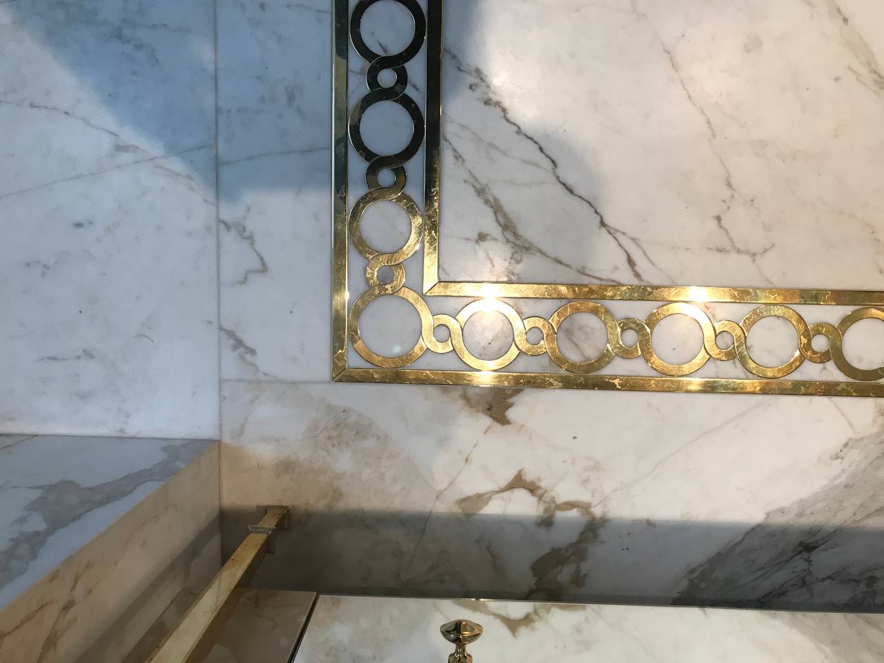 Calacatta marble with bespoke brass inlay detail