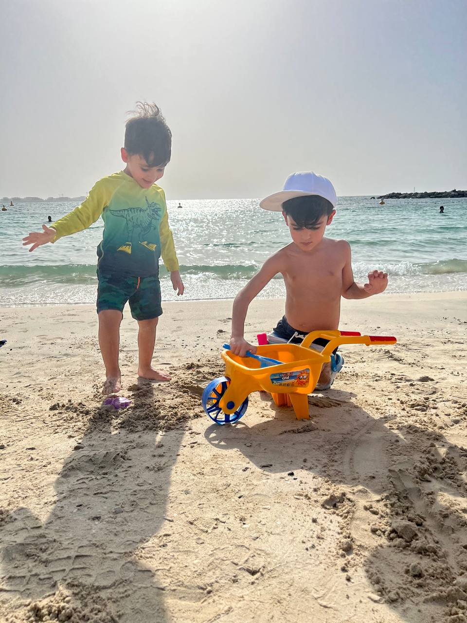 Adrian and Darian Nazemi on Dubai beach — first year in the UAE, 2021