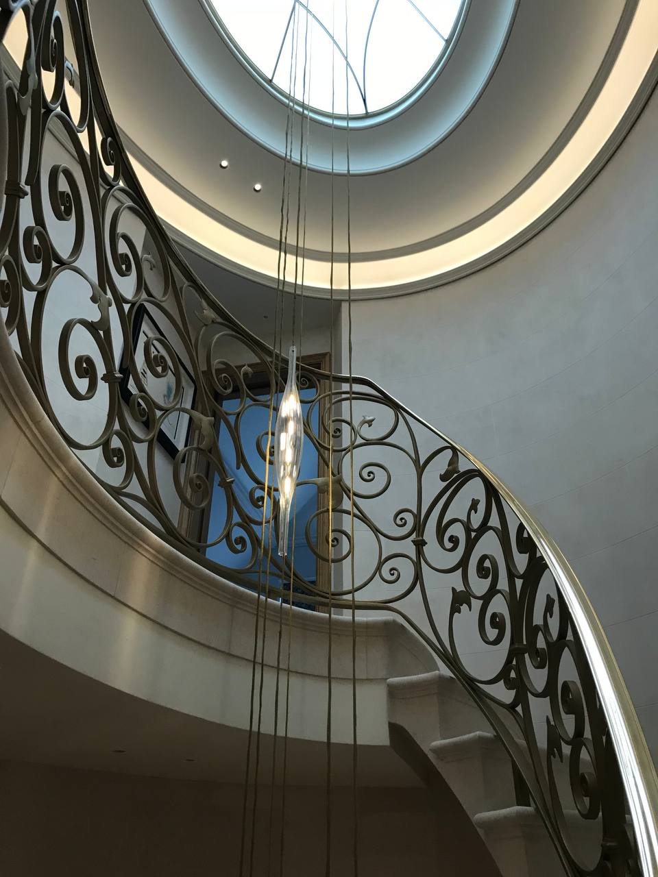 Staircase from ground level — oval skylight above