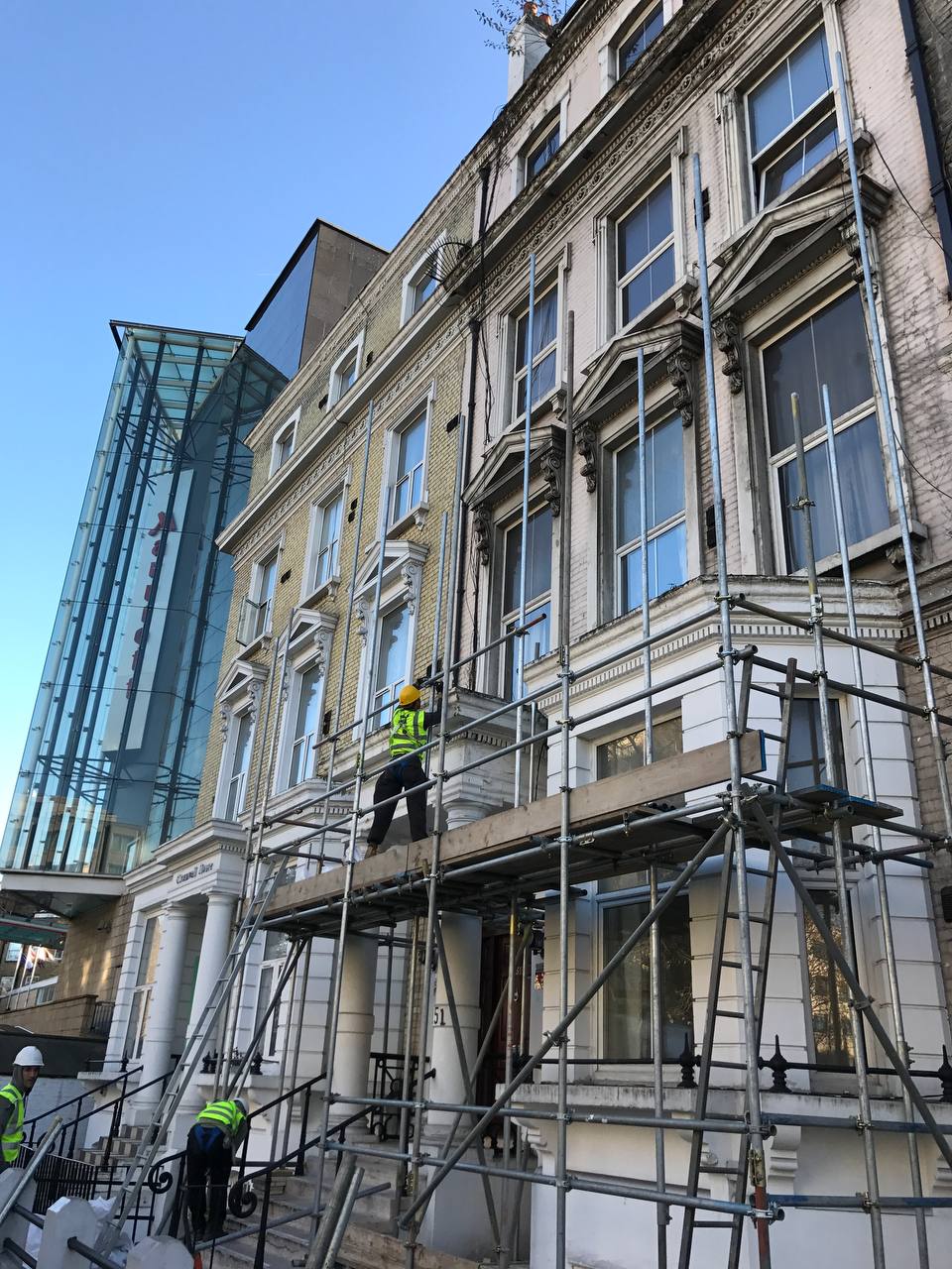 Nazemi Construction — scaffolded Victorian townhouse