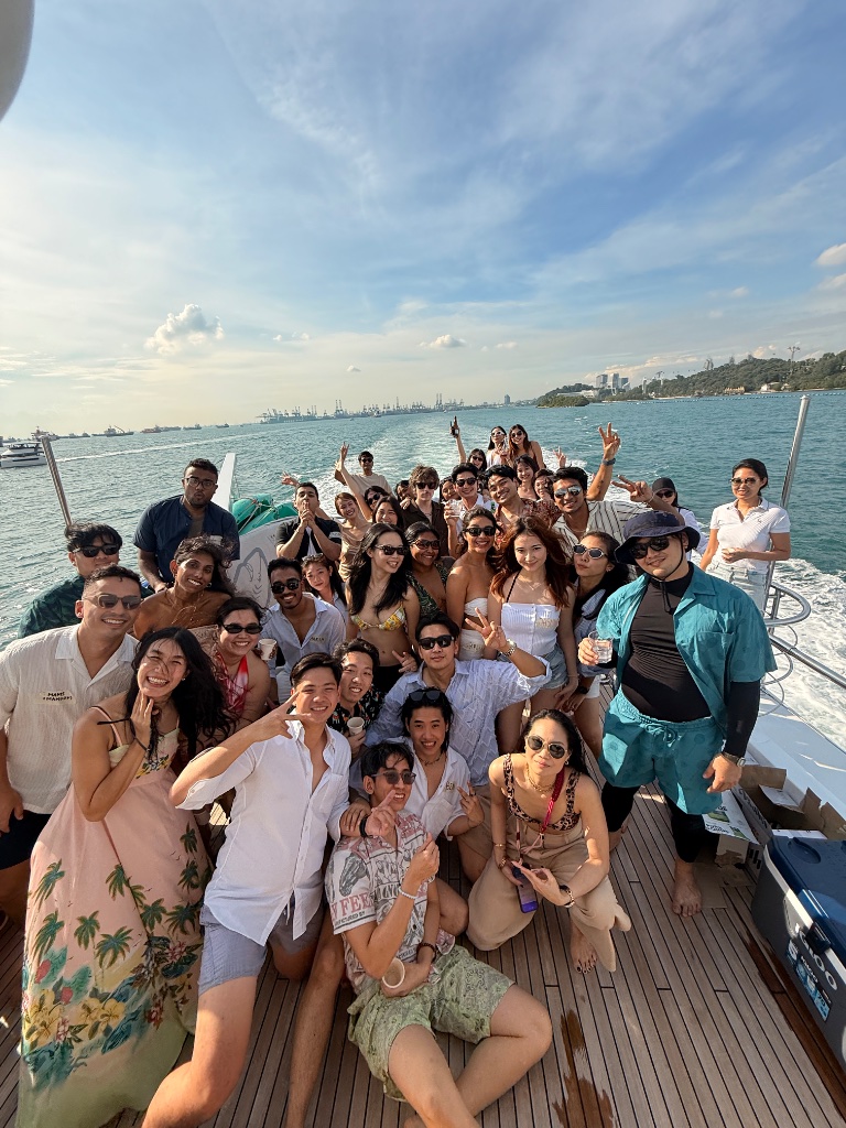 Le-Munity members enjoying a yacht day on the water in Singapore