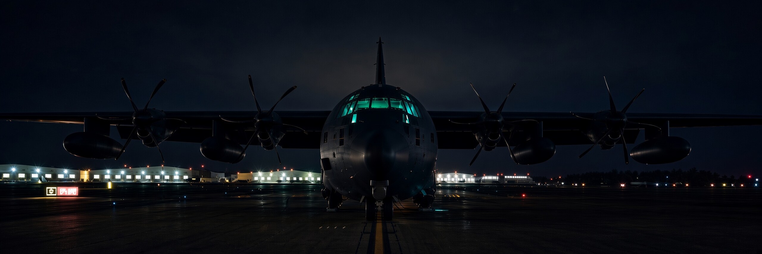 C-130 Hercules on the tarmac at night