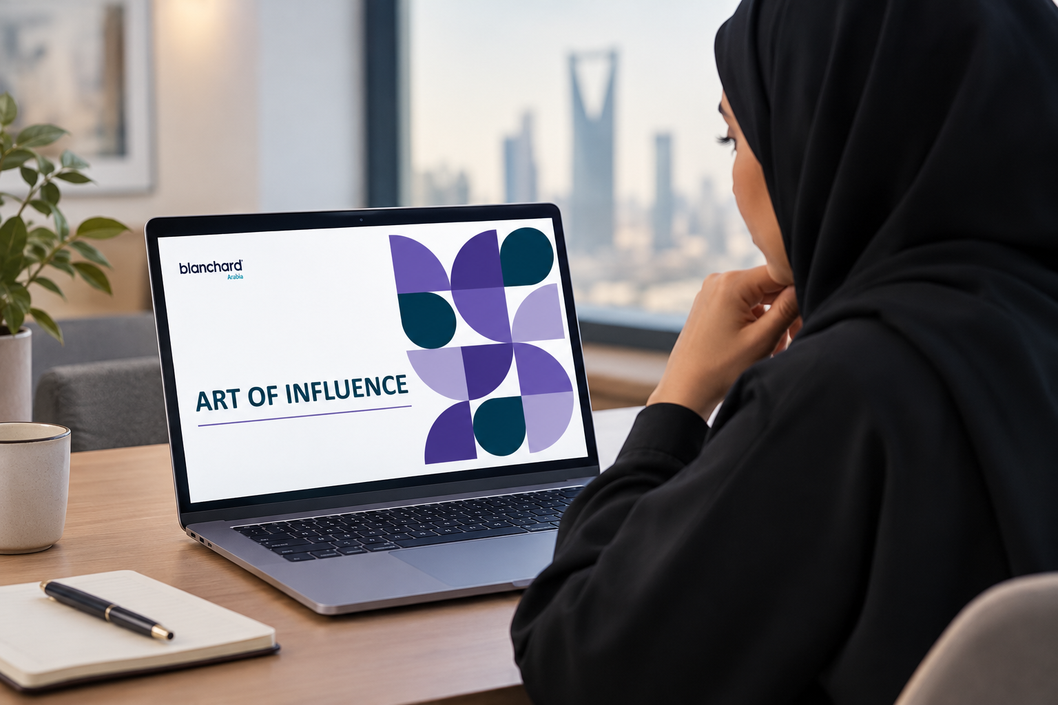 Art of Influence leadership development program by Blanchard Arabia, featuring a GCC professional woman learning on a laptop.