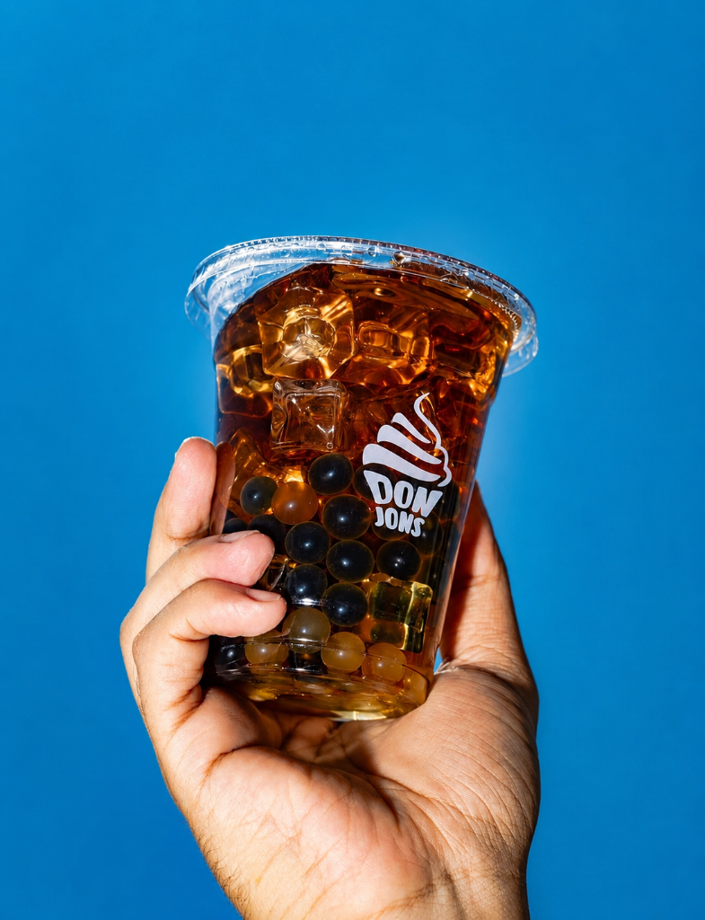 Iced boba drink on blue background
