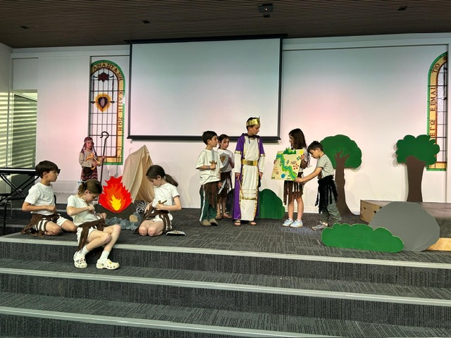 Children performing a Bible play on stage