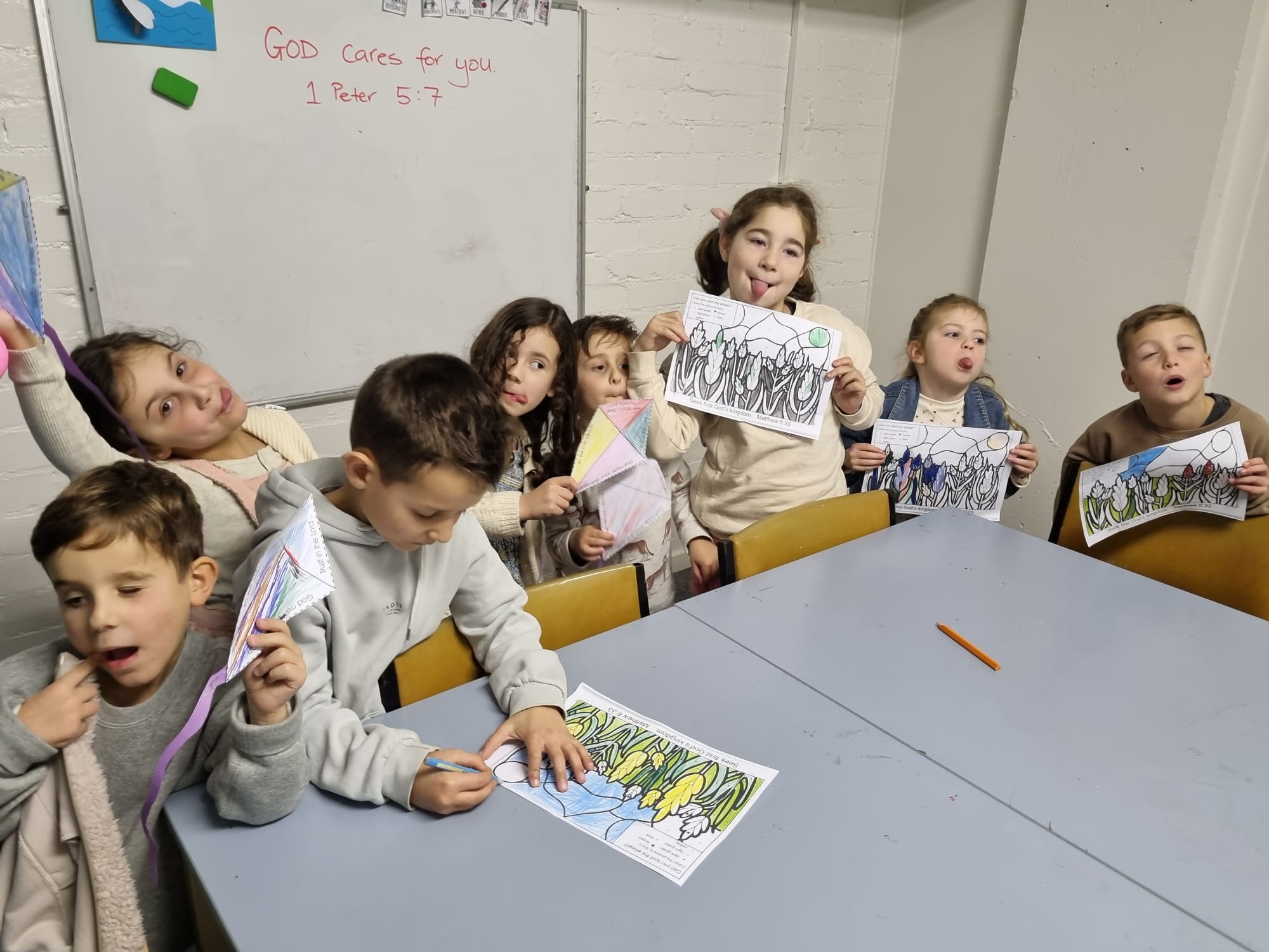 Children showing their artwork
