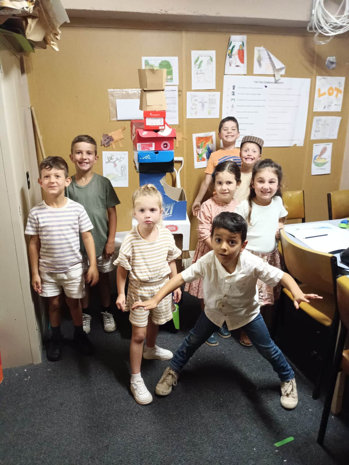 Young children posing in the classroom