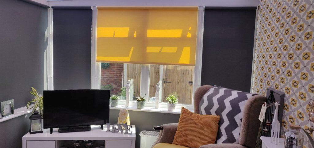 Yellow roller blind installed in a bright York sunroom
