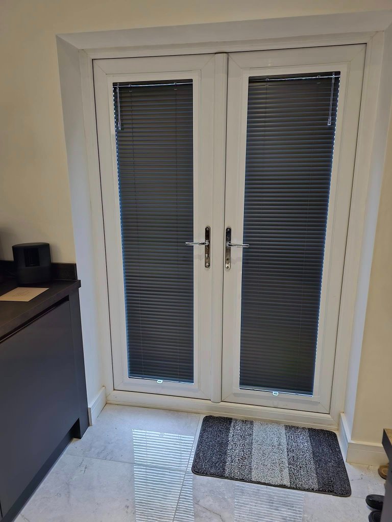 Perfect Fit pleated blinds fitted on double doors in a Wetherby home