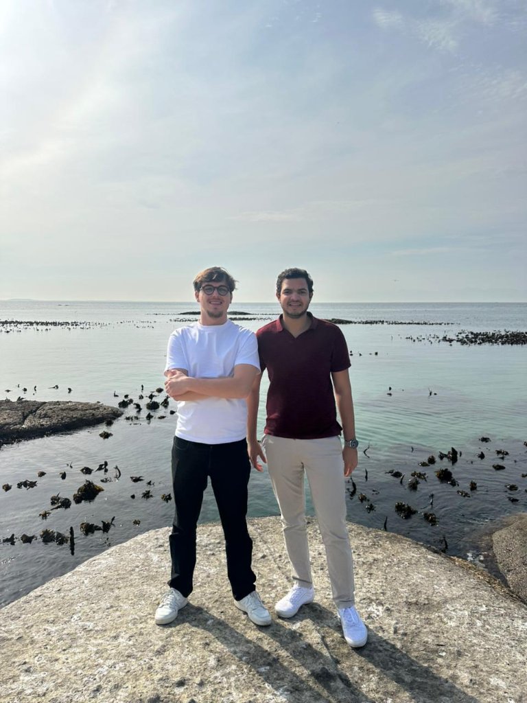 Guests on a granite rock by the ocean
