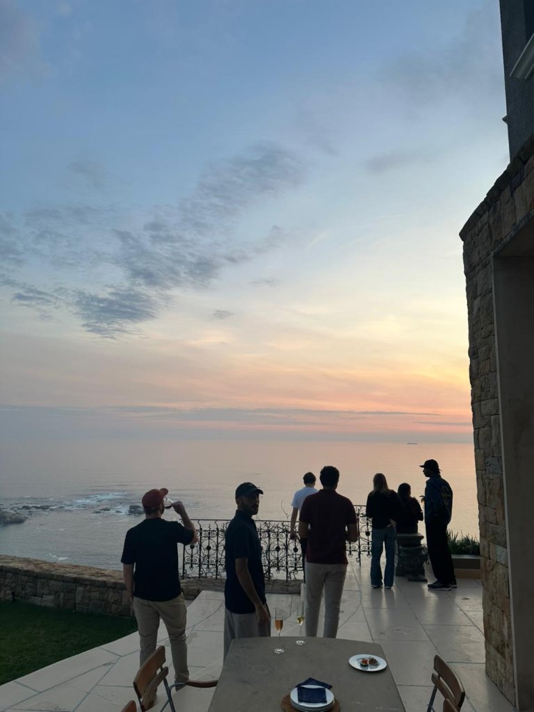 Sunset drinks on a terrace overlooking the ocean