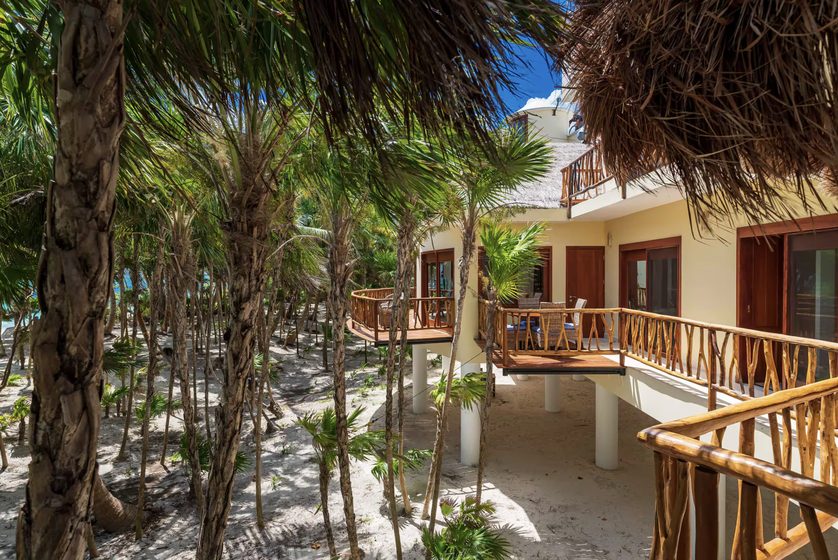 Villa on stilts among the palms