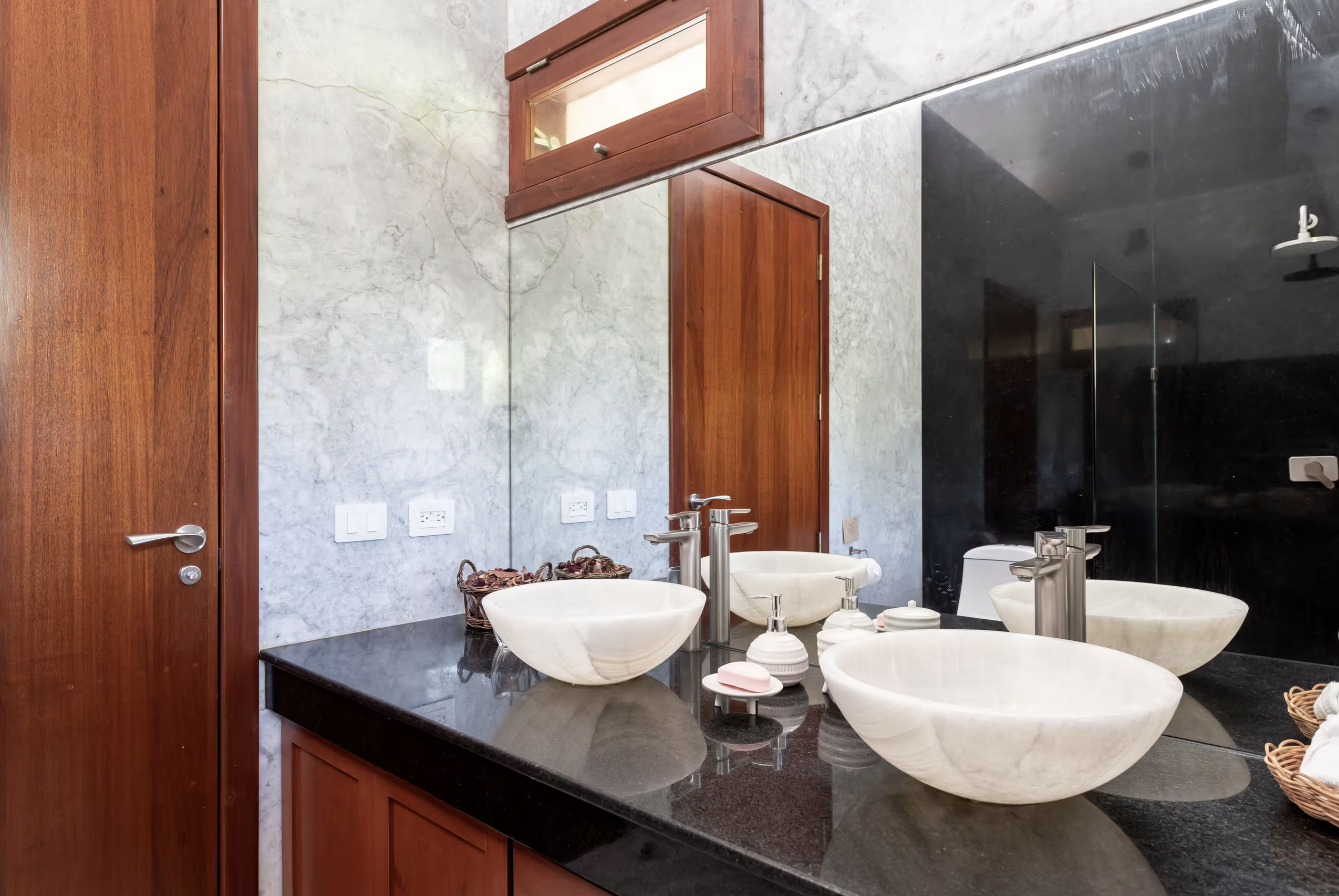 Double vanity with marble wall