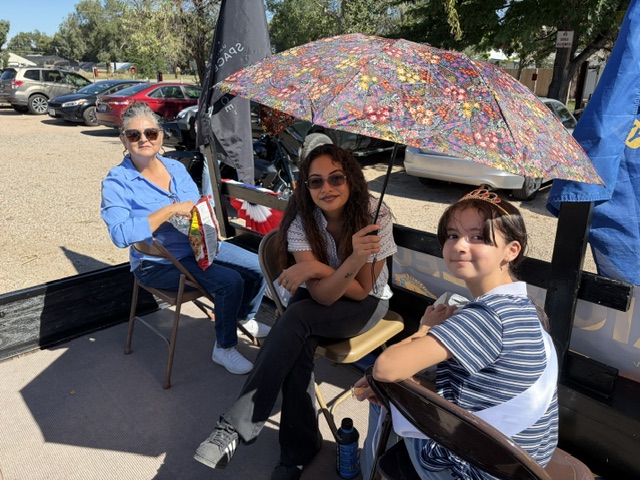 Avondale Veteran's Parade — participants on parade float with floral umbrella