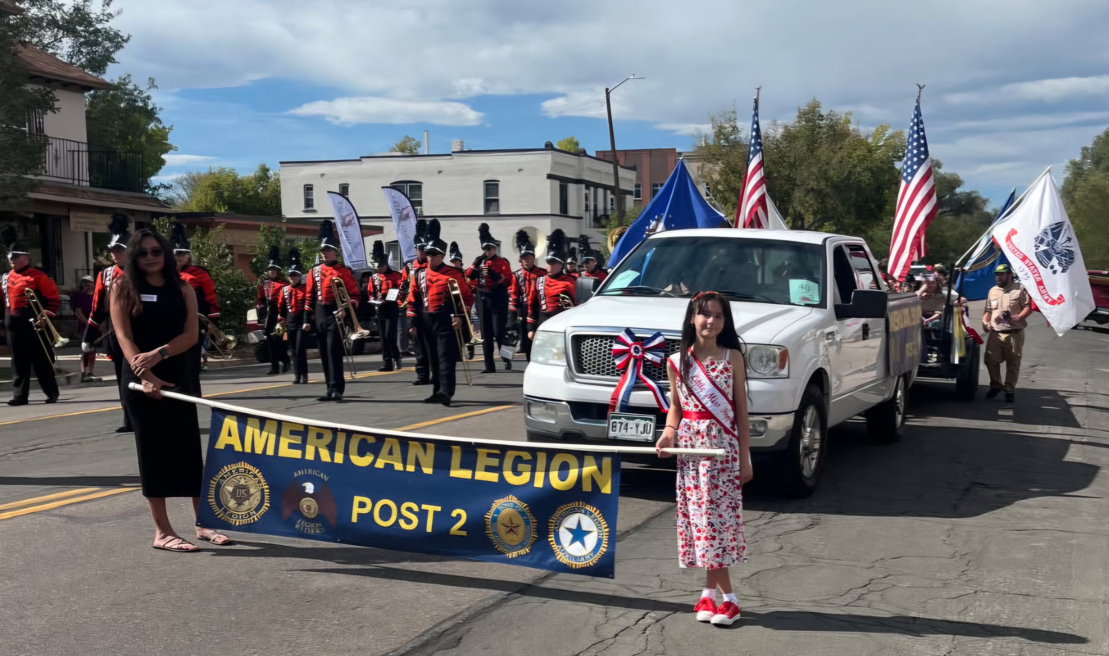 2026 Colorado State Fair Parade — American Legion Post 2 banner with Little Miss and Auxiliary member