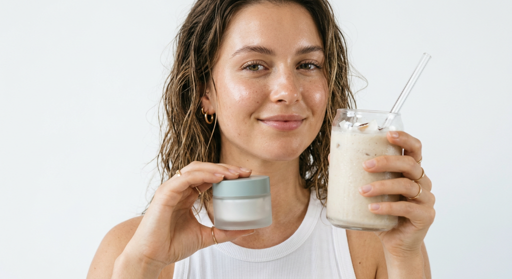 Model holding Hydra Coco Cream and coconut smoothie