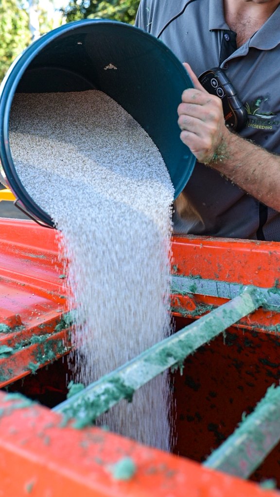 Seed and mulch being loaded into a hydroseeding tank