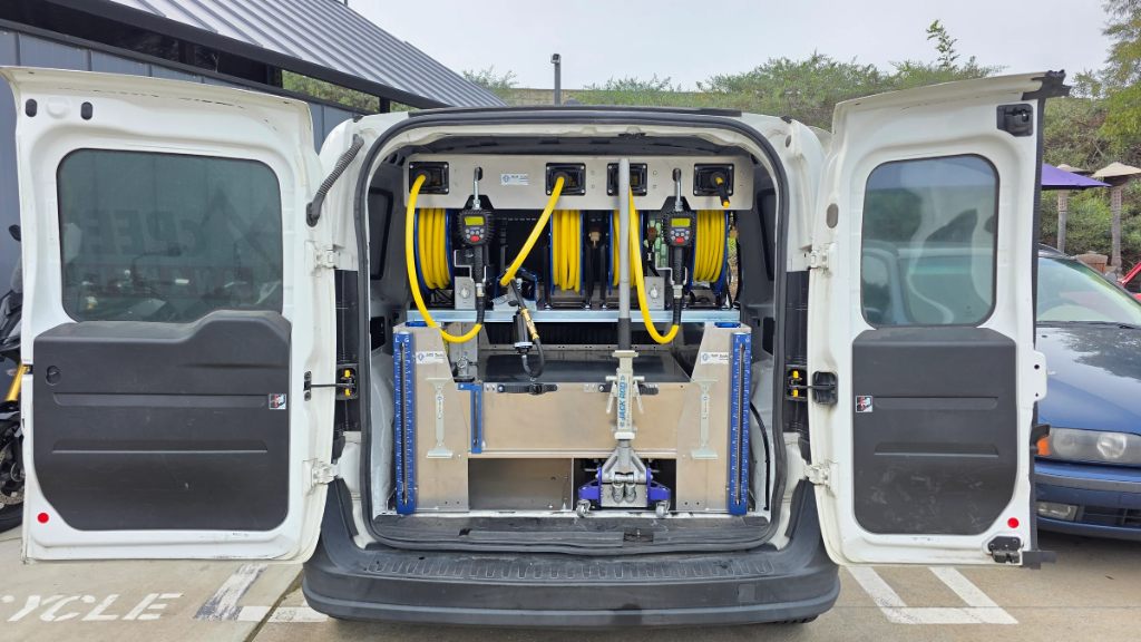 OilFlash service van interior showing professional oil dispensing equipment