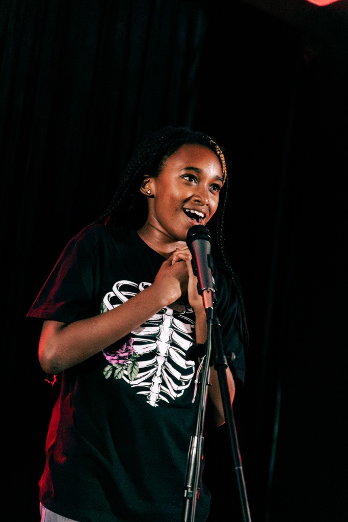 Young artist performing on stage
