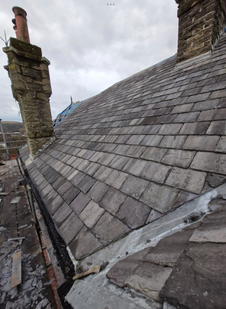 Slate roof repair between chimneys