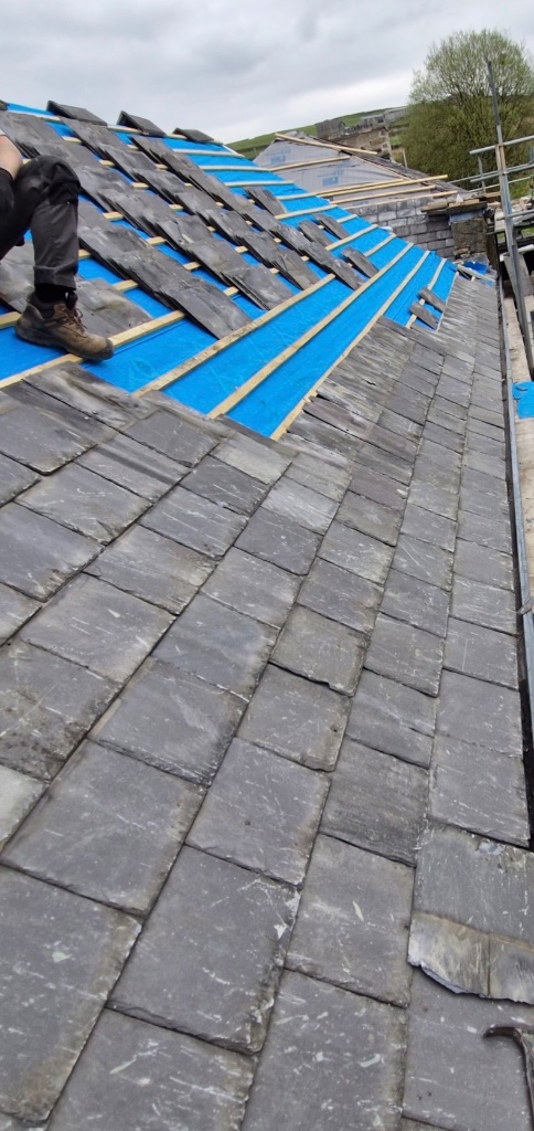 Slating in progress over new membrane