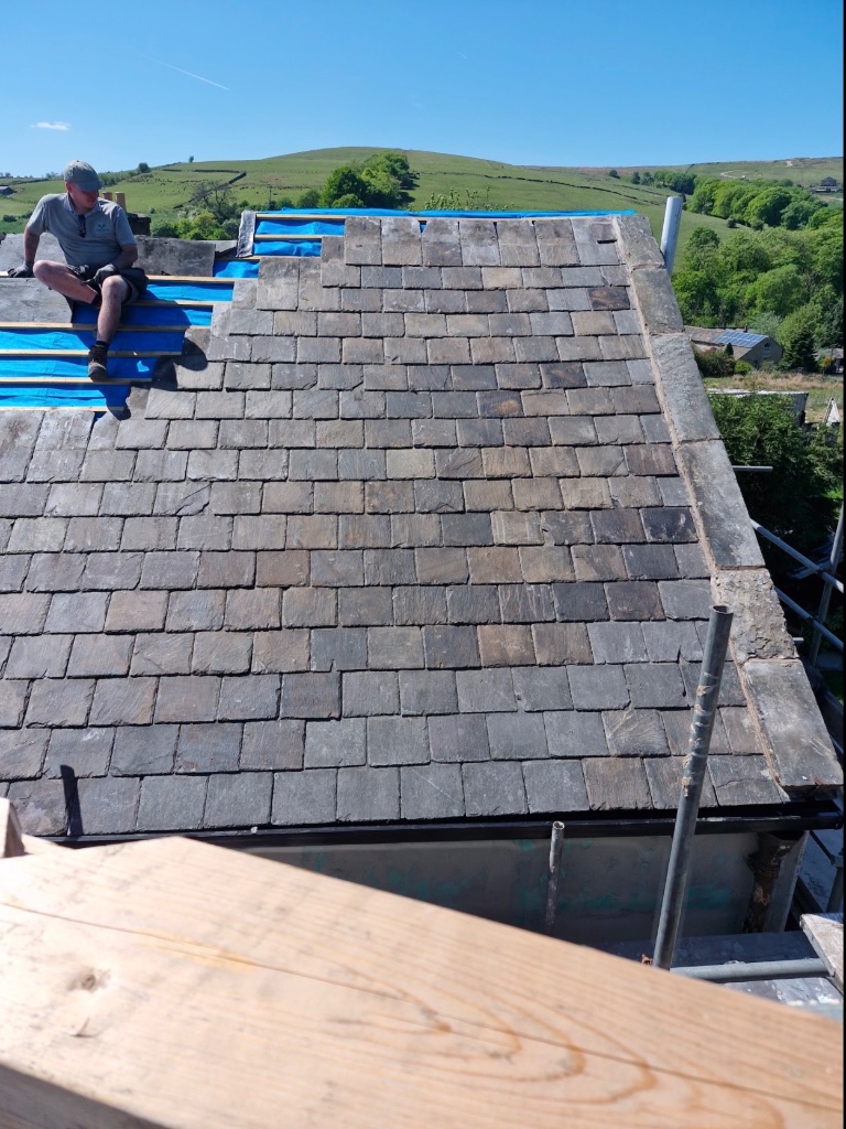 Re-roofing in progress with scaffolding