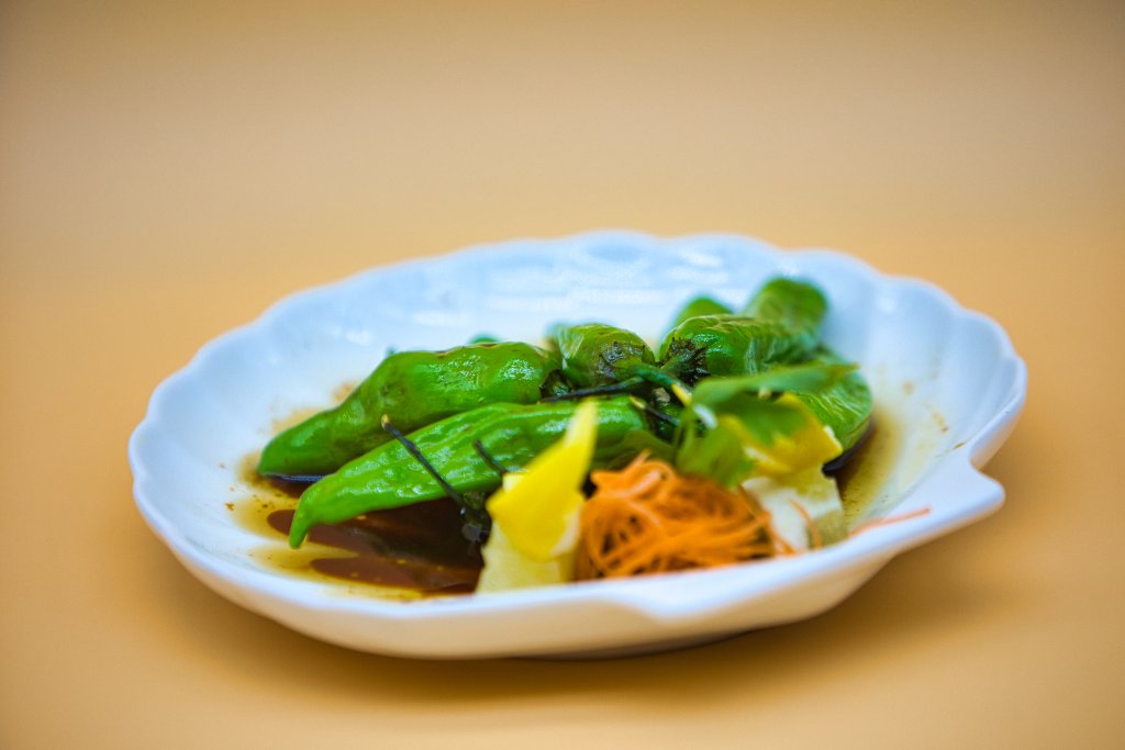 Shishito peppers close-up in shell dish