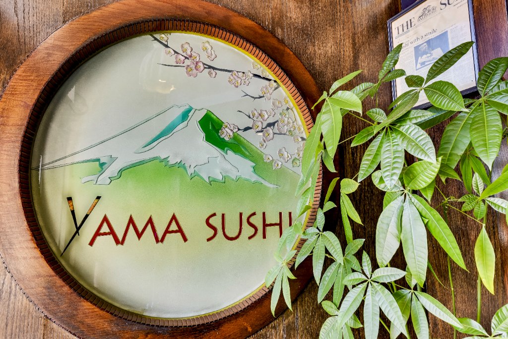 Yama Sushi decorative logo sign with greenery