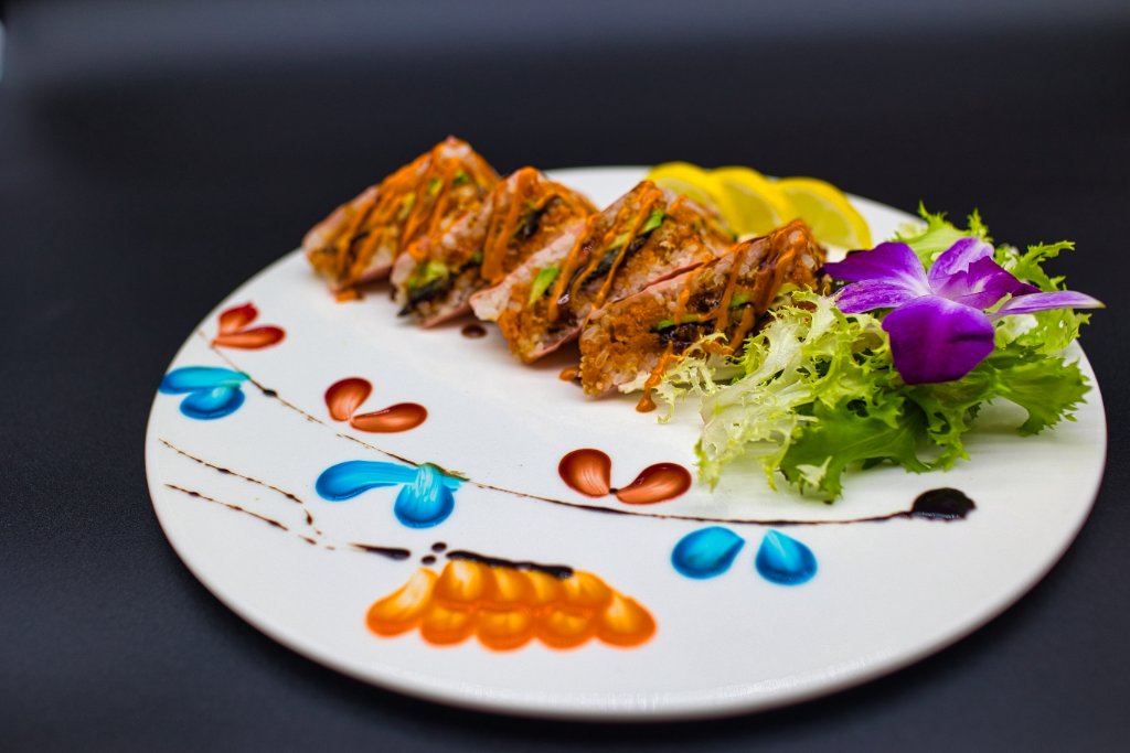 Avocado caterpillar roll on banana leaf