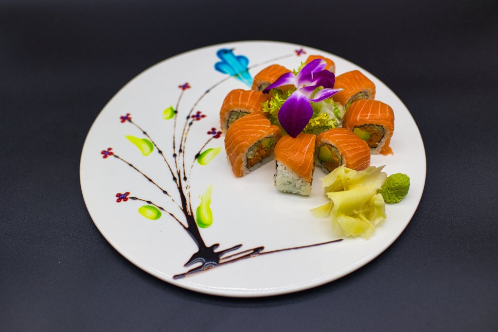 Simple avocado cucumber roll on white plate