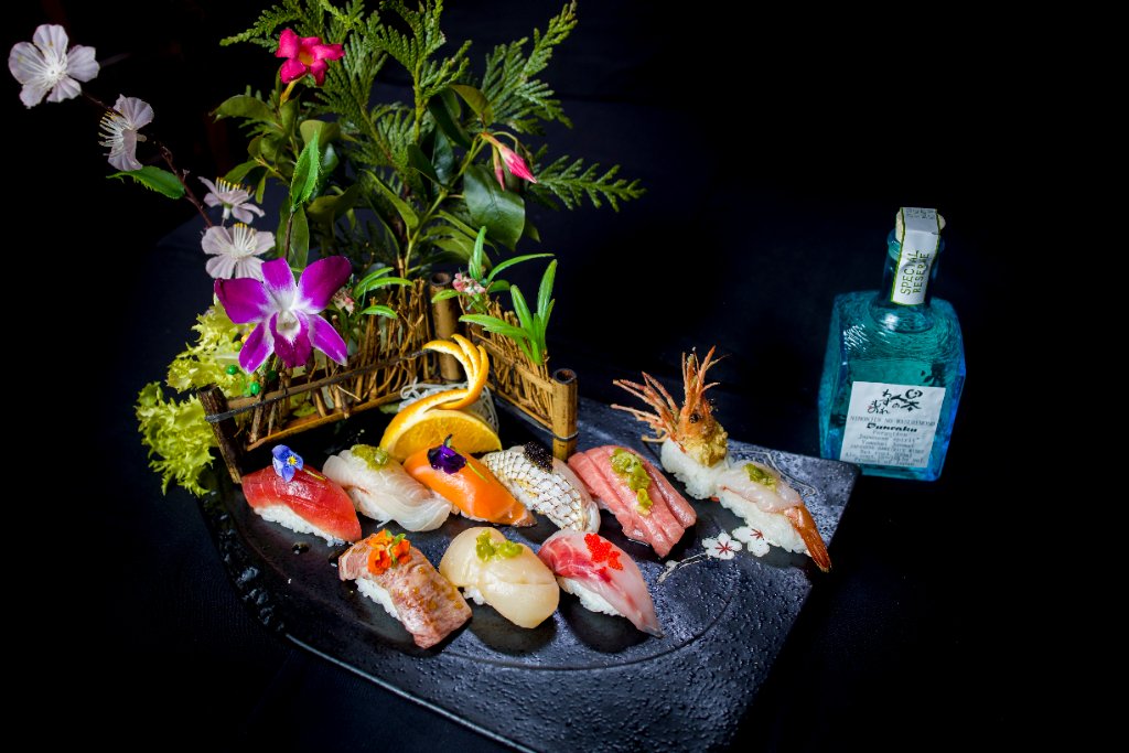 Sushi assortment with botanical decor
