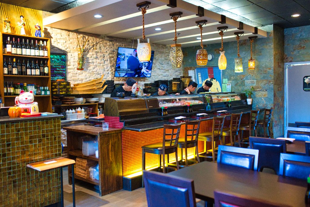 Sushi bar counter with chef