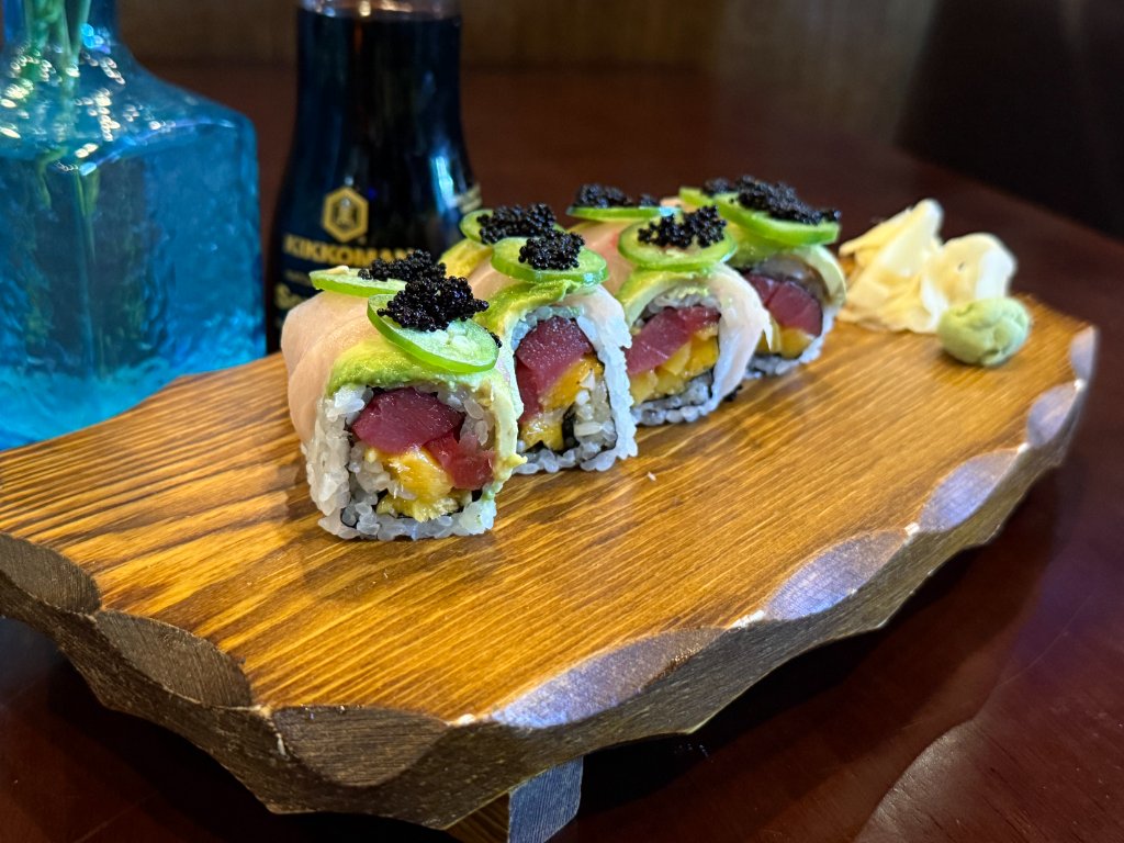 Elegant sushi presentation with rose