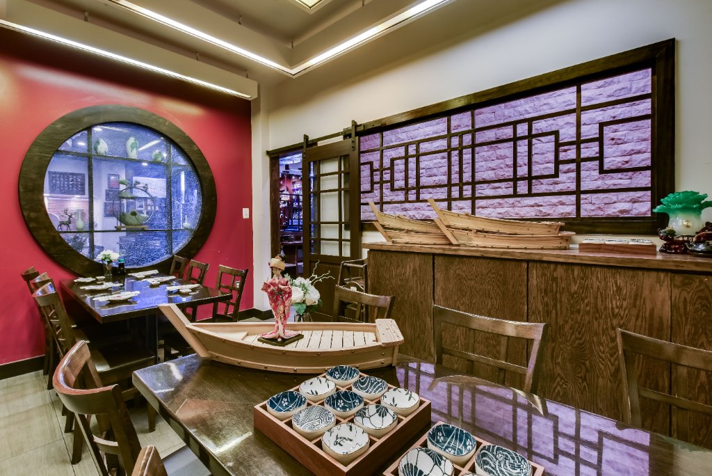 Private party room with sushi boat display