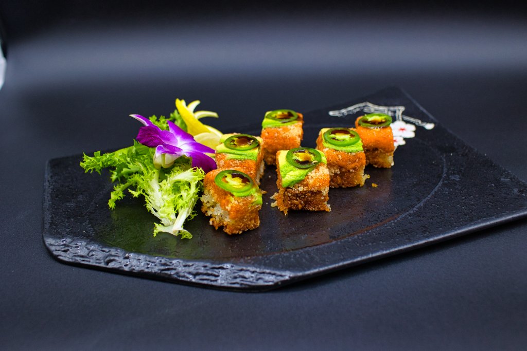 Spicy roll with jalapeño on black slate