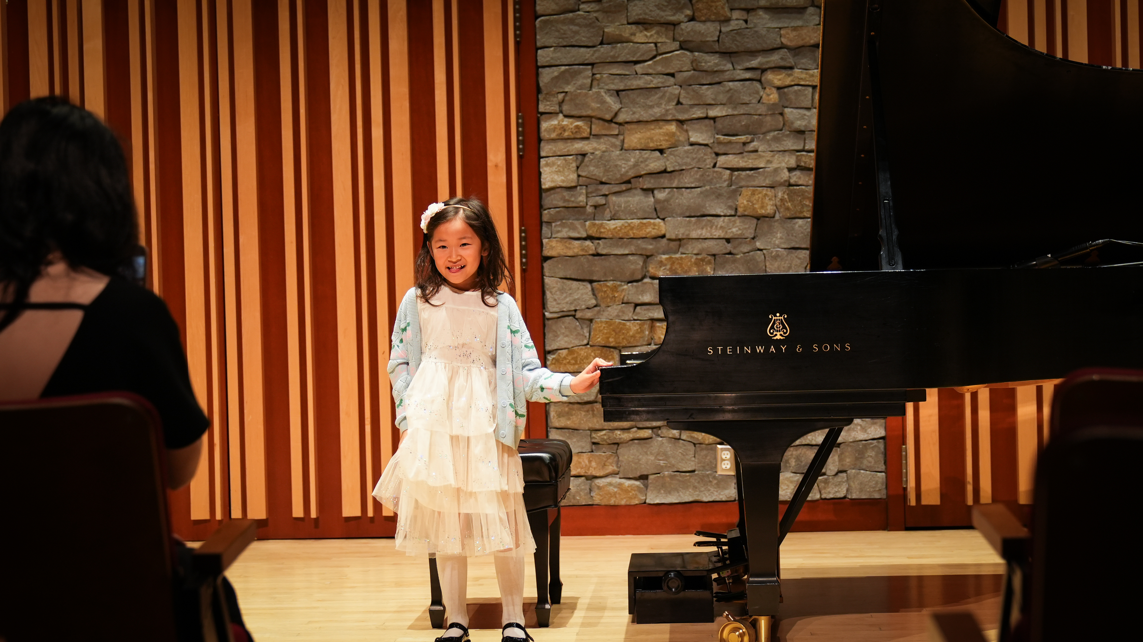 Student bowing after performance