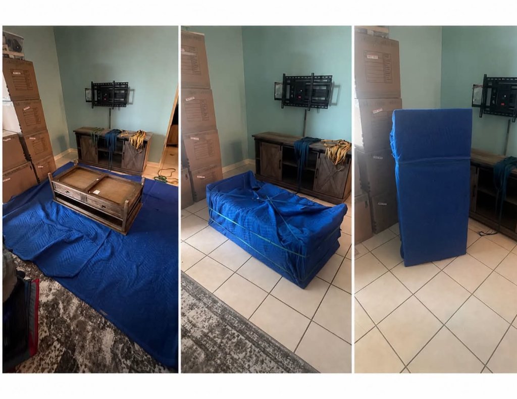 Mover carefully wrapping furniture in protective blankets
