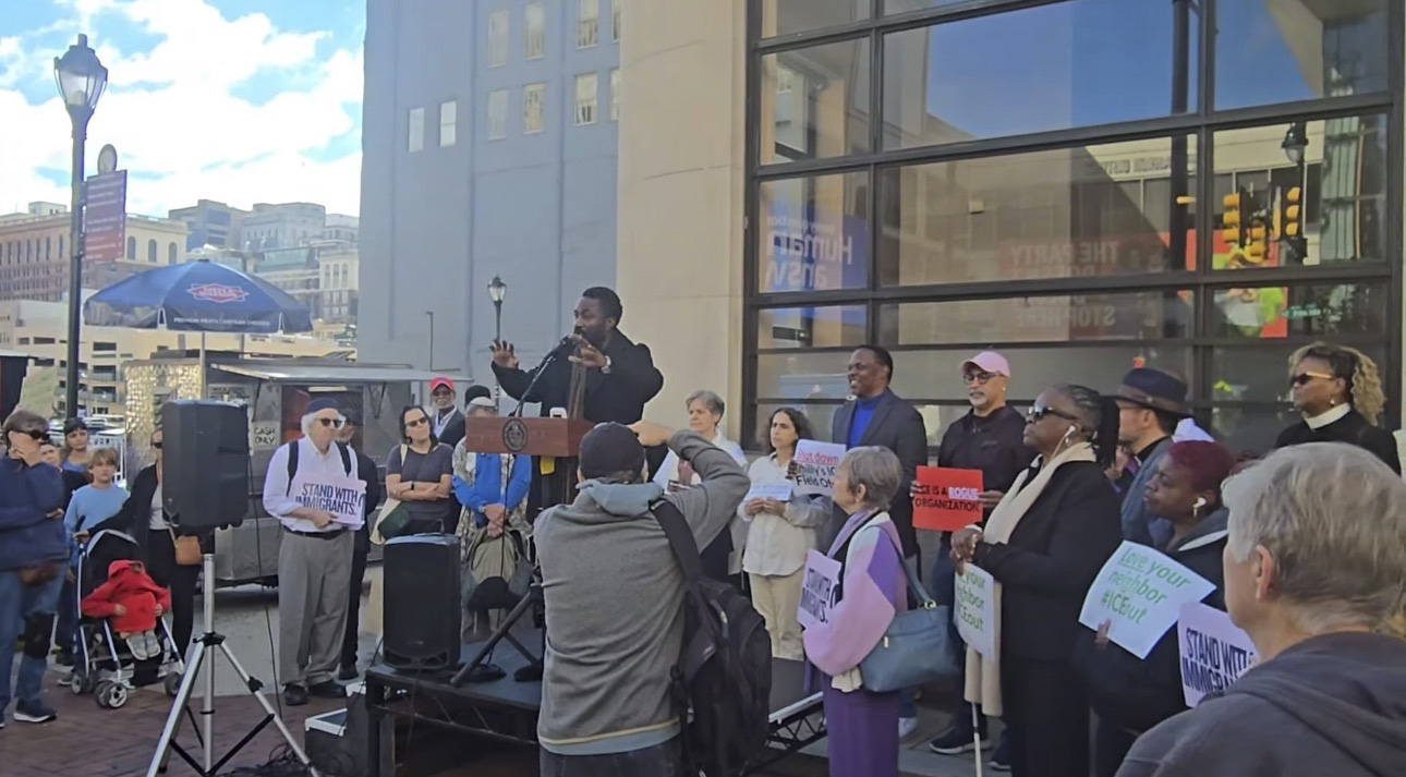 John Nforba, CIMS Immigration Rights Coordinator, speaking at a community rally in Philadelphia