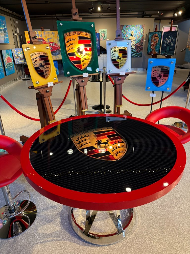 Gallery display of floating glass automotive art