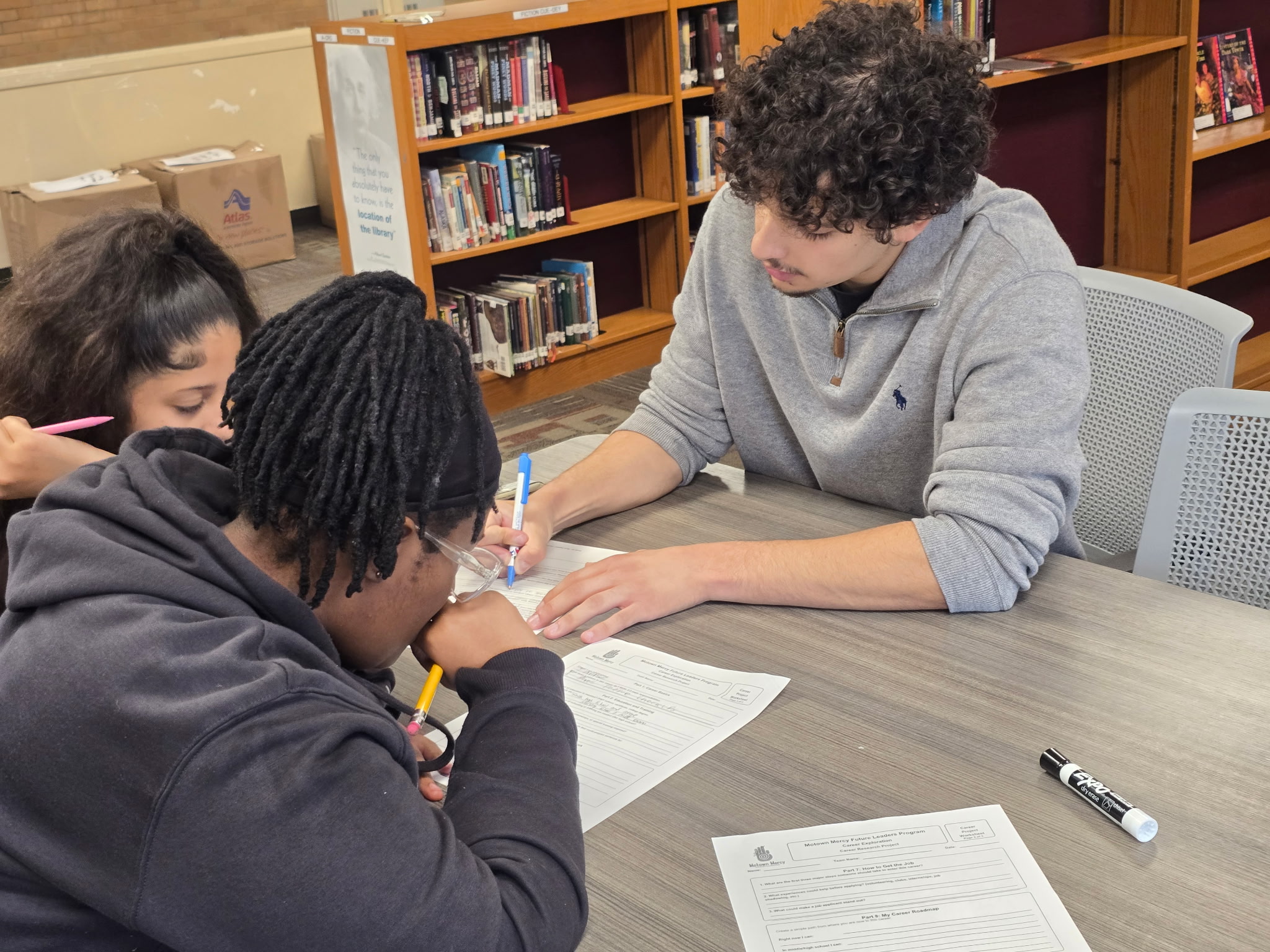 Motown Mercy volunteers working with Pontiac School District students