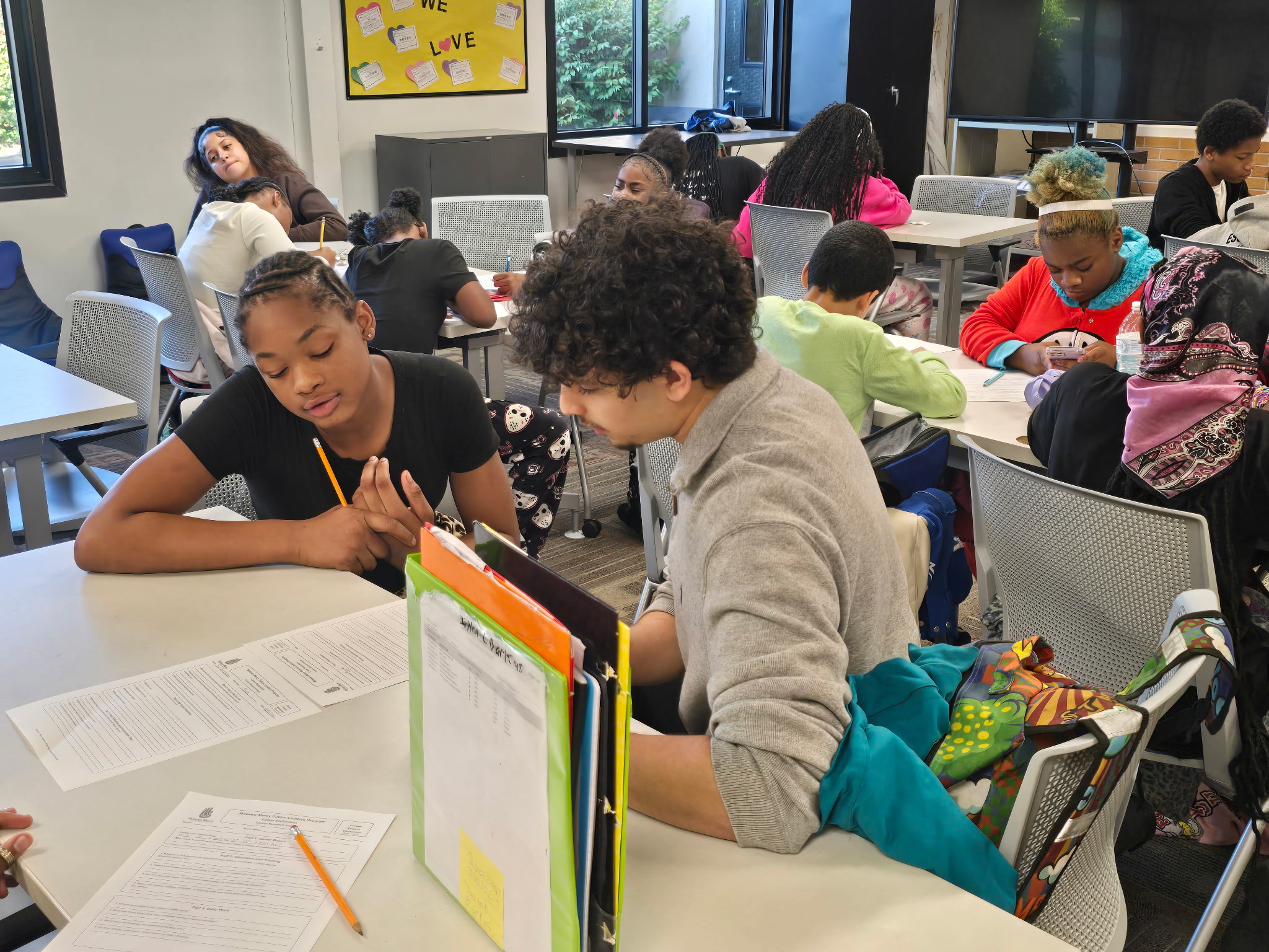 Motown Mercy volunteers working with Pontiac School District students